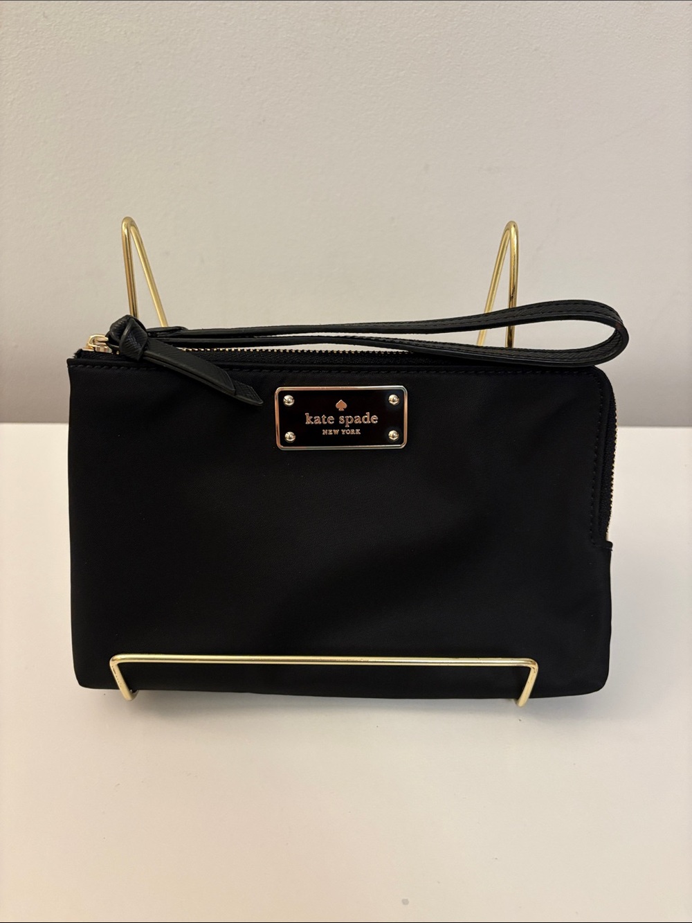 kate spade black wristlet clutch with gold plaque